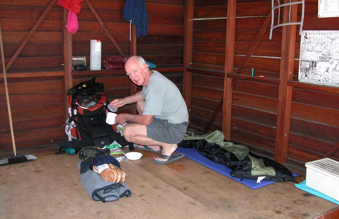 Mal ratting in his pack, crouched in his corner of the shelter situated on the Nullaki Peninsula
