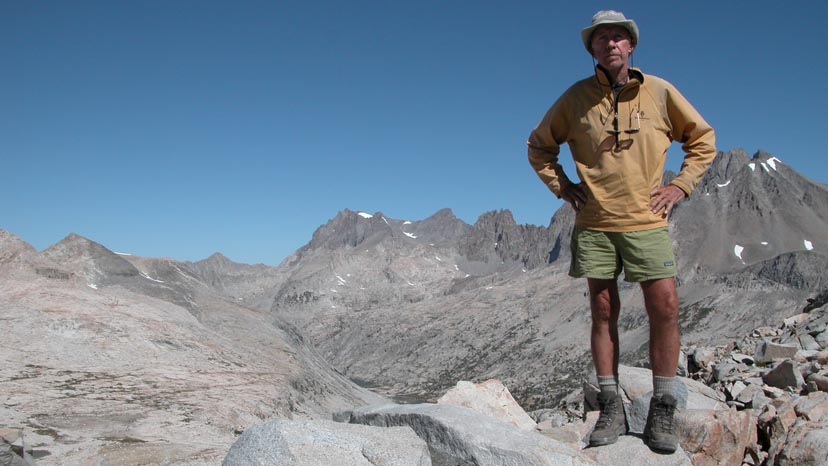 Peter standing on the summit of Mather Pass.  The Palisades behind.
