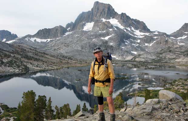 Peter standing on the Trail overlooking Thousand Island Lake with Banner Peak above. 