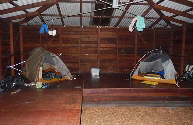 Using the inner sections of our tents as mosquito nets in the Shelters.