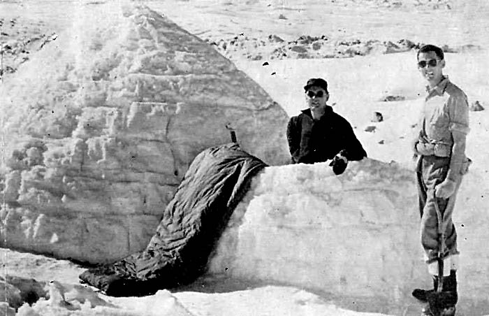 Tasman Glacier 1959: The completed igloo with Wally Tarr and Pete Rule residing.