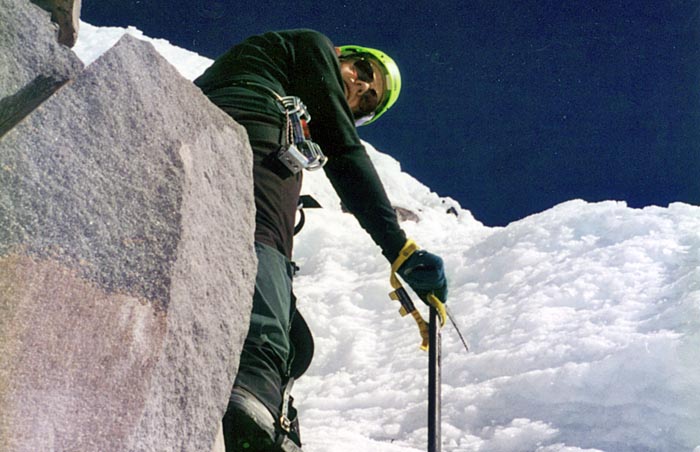 1997: Peter seaching out a route on the summit pinnacle