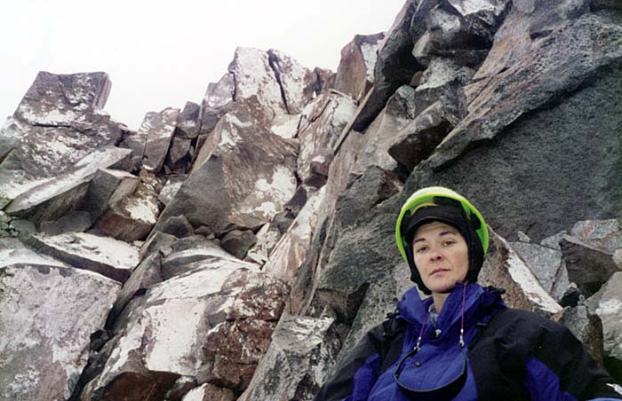 1997:  Final success - Lucy resting on the summit rocks, unfortunately in cloud!
