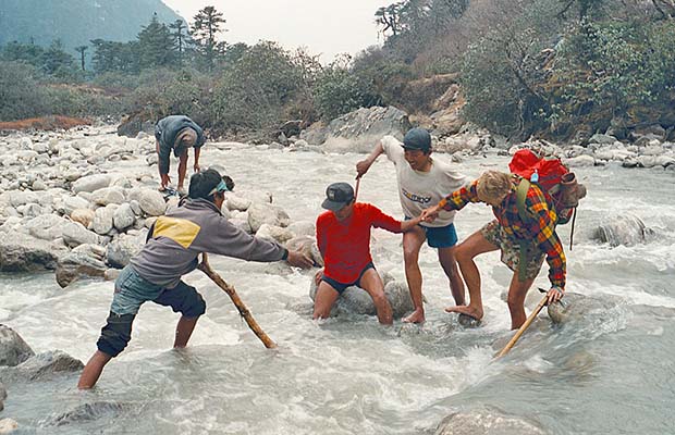 Crossing a flooded Hinku Khola without the use of a bridge!