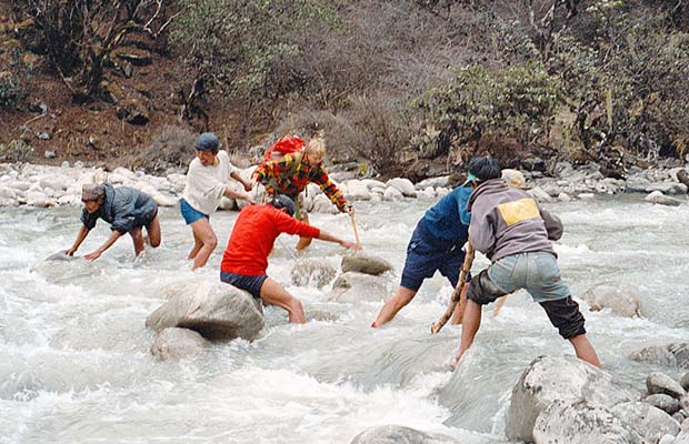 Crossing a flooded Hinku Khola without the use of a bridge!