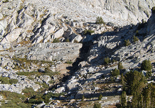 The access to the higher lakes & Feather Pass from Merriam Lake.