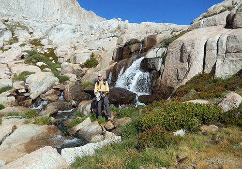 Bob on the high crossing of the waterfall below Sky Blue Lake