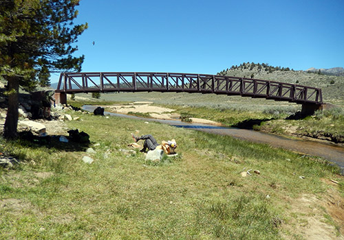 The PCT bridge over the River Kern.  Bob relaxing in the grass.