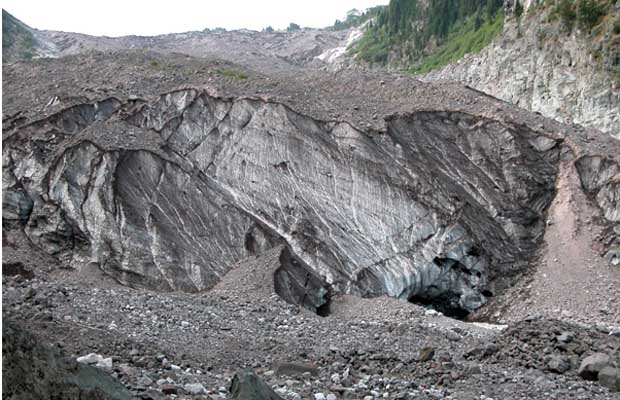 The icy snout of Carbon Glacier at an elevation of only 3,600'.