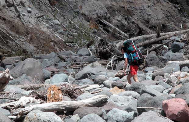 Lucy crossing the deep wash-out of the Kautz Creek ... a stumble over large boulders.